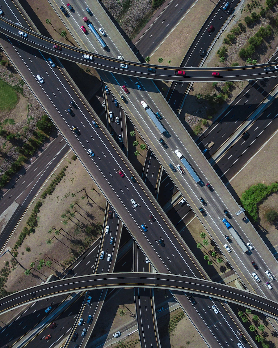 aerial-view-busy-highway-intersection-full-traffic-during-daytime_181624-46287